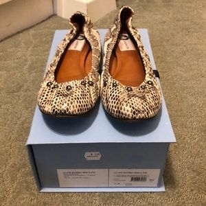 Black and white snake skin leather flats